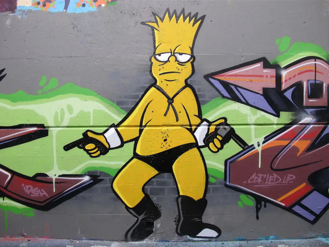 Graffitis de los Simpson- pistolas en la mano